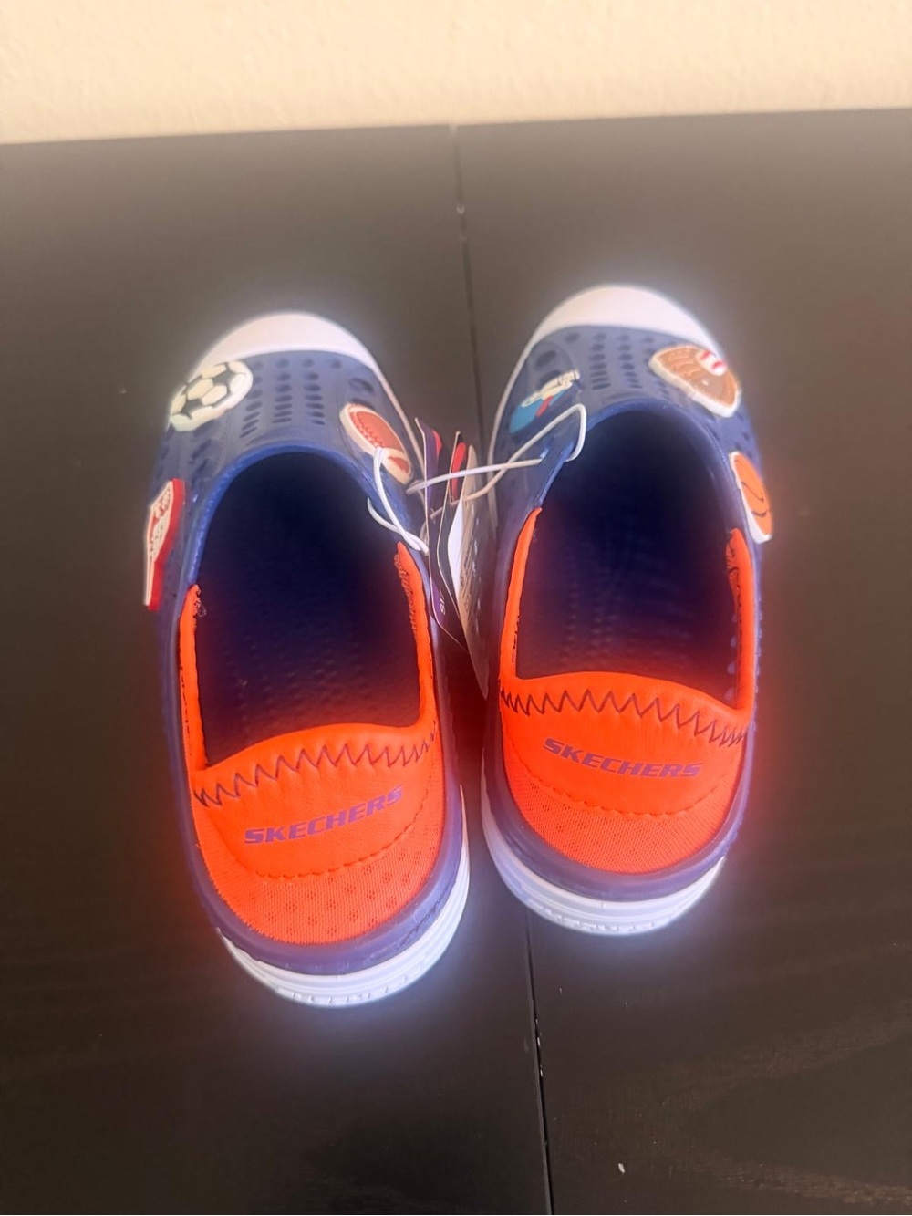 Skechers Kids Navy and Orange Slip-On Sneakers with Sports Patches